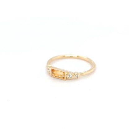 Image of 9ct Yellow Gold Ring featuring a 0.31ct Baguette Citrine and 4 Round Cut Natural Diamonds 