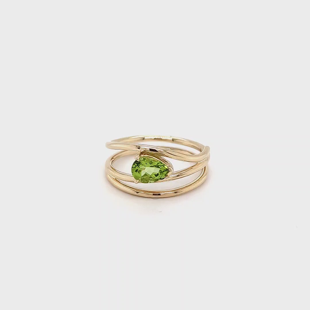 Load video: PEAR SHAPED PERIDOT RING